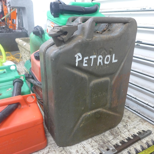 2244 - A metal Jerry can and 10 petrol cans