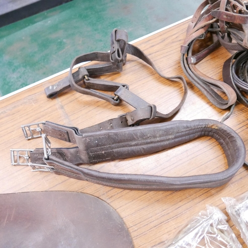 2324 - A horse saddle and tack