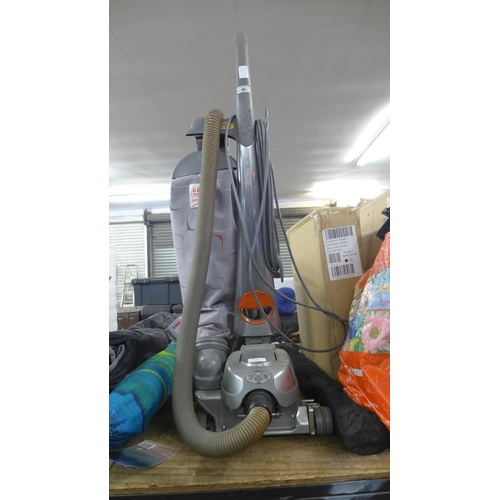 2415 - A Kirby upright vacuum cleaner with attachments