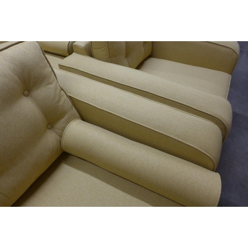 1367 - A set of mustard upholstered button backed three seater, two seater sofas and an armchair