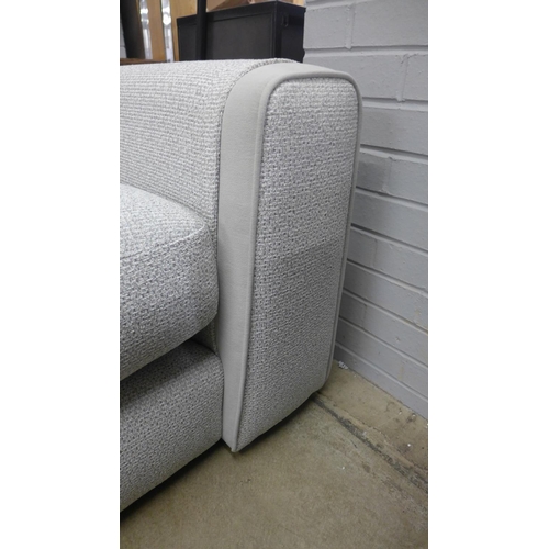 1381 - A textured weave light grey love seat