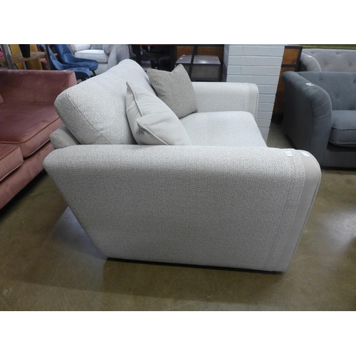 1381 - A textured weave light grey love seat