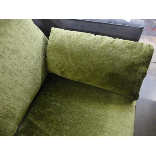 1400 - A moss green velvet upholstered three seater sofa