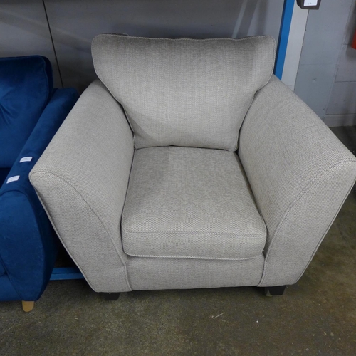 1434 - An oatmeal textured weave upholstered three seater sofa and armchair