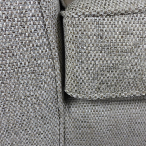 1434 - An oatmeal textured weave upholstered three seater sofa and armchair