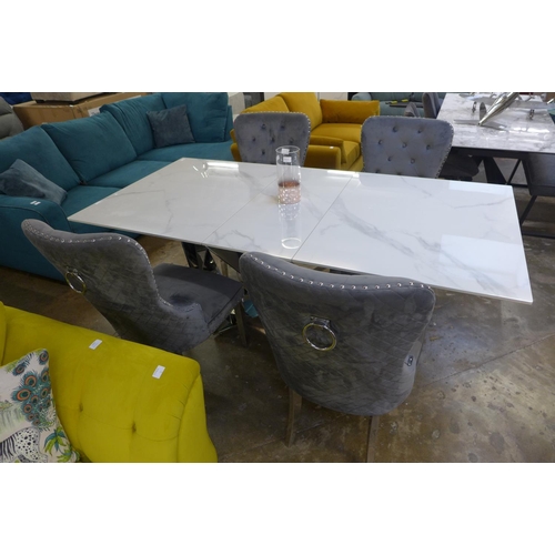 1445 - A Marvel 1.6-2m extending dining table with a set of four Chelsea grey velvet upholstered dining cha... 