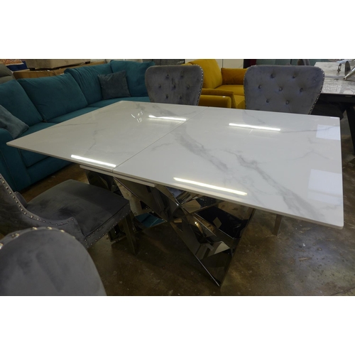1445 - A Marvel 1.6-2m extending dining table with a set of four Chelsea grey velvet upholstered dining cha... 