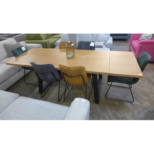 1450 - An oak 1.5m - 2.4m extending dining table with black lets and a harlequin set of six diamond stitch ... 