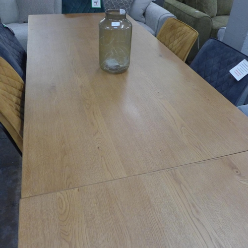 1450 - An oak 1.5m - 2.4m extending dining table with black lets and a harlequin set of six diamond stitch ... 