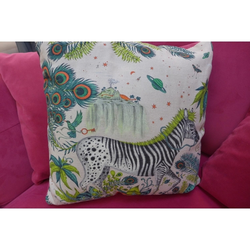 1458 - A raspberry velvet upholstered love seat with buttoned arms and zebra design scatter cushion