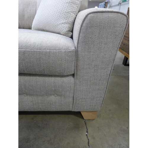 1467 - An oatmeal textured weave upholstered 2.5 seater sofa