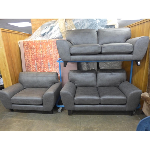 1485 - A dark grey vegan leather upholstered three seater, two seater and love seat