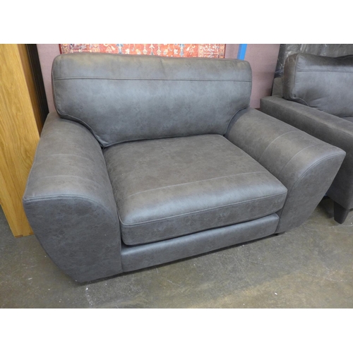 1485 - A dark grey vegan leather upholstered three seater, two seater and love seat