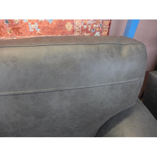 1485 - A dark grey vegan leather upholstered three seater, two seater and love seat