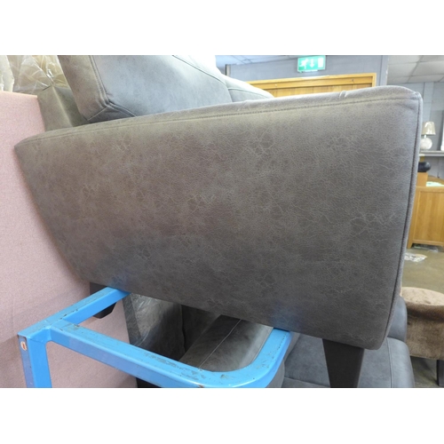 1485 - A dark grey vegan leather upholstered three seater, two seater and love seat