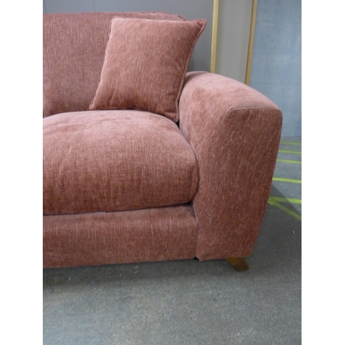 1497 - A dusty red textured velvet upholstered two seater sofa