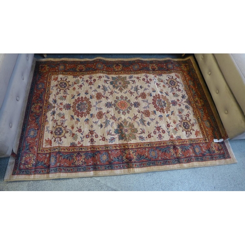 1503 - A small gold ground 100% wool pile Turkish rug