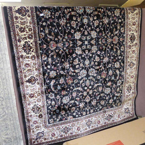 1519 - A black ground fine woven Iranian carpet with all over floral pattern