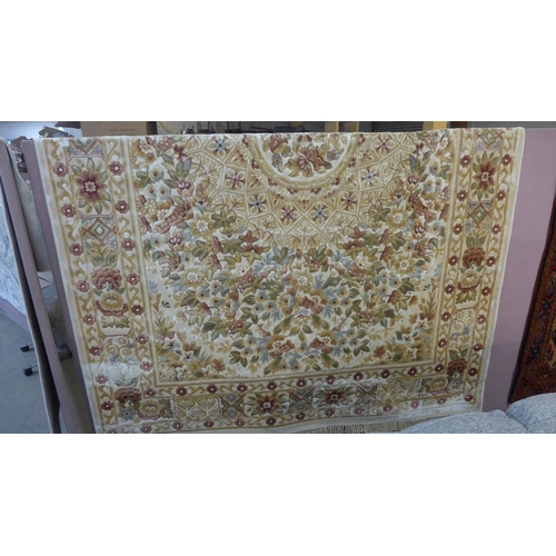 1525 - A gold ground full pile, floral Chinese carpet (330cm x 240cm)