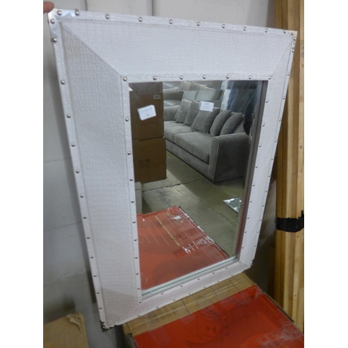 1537 - A white leather effect and studded framed mirror