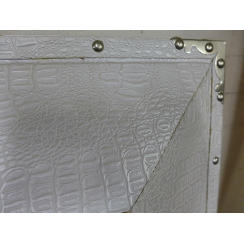 1537 - A white leather effect and studded framed mirror