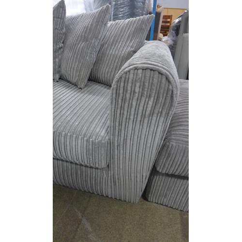 1544 - A grey jumbo cord three seater sofa and mink footstool