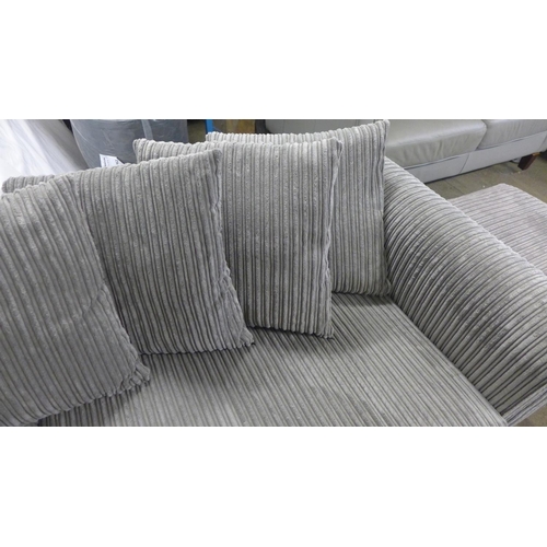 1544 - A grey jumbo cord three seater sofa and mink footstool