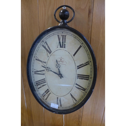 1565 - A double sided hanging clock