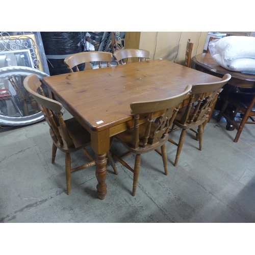 1602 - A pine kitchen dining table and a set of five dining chairs