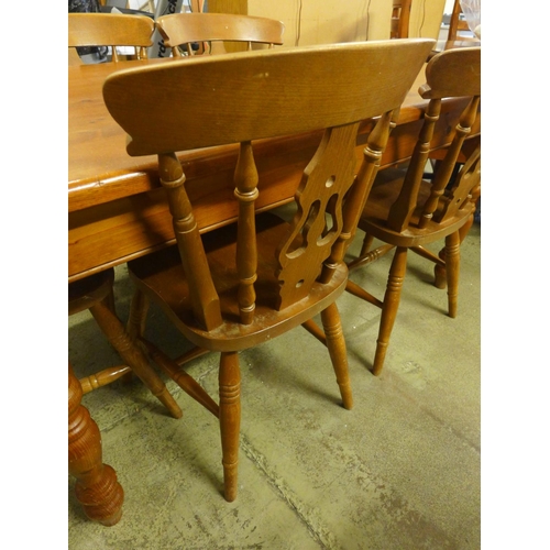 1602 - A pine kitchen dining table and a set of five dining chairs