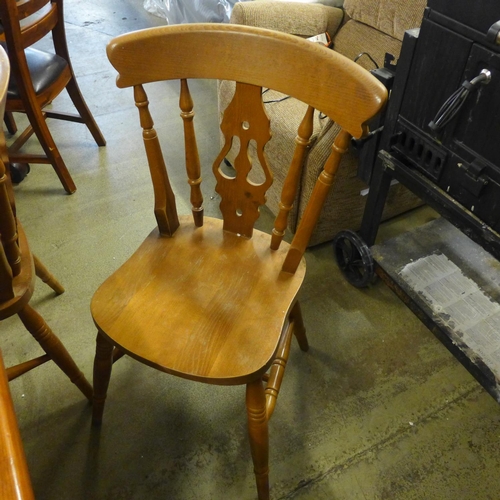 1602 - A pine kitchen dining table and a set of five dining chairs