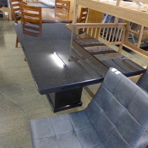 1604 - A black speckled granite effect dining table