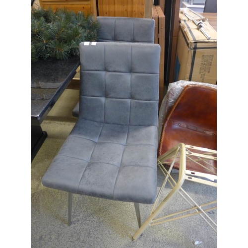 1606 - A pair of grey suede effect dining chairs