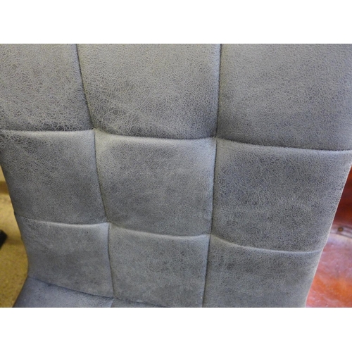 1606 - A pair of grey suede effect dining chairs