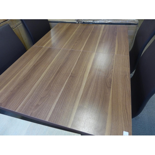 1615 - A Mark Webster walnut effect extending dining table with black base and four brown and chrome chairs