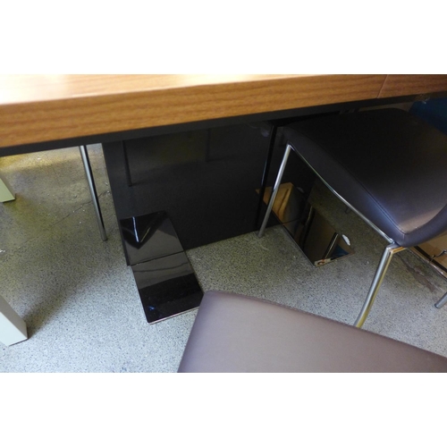 1615 - A Mark Webster walnut effect extending dining table with black base and four brown and chrome chairs