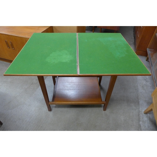 101 - An Eastcraft teak fold-over games table