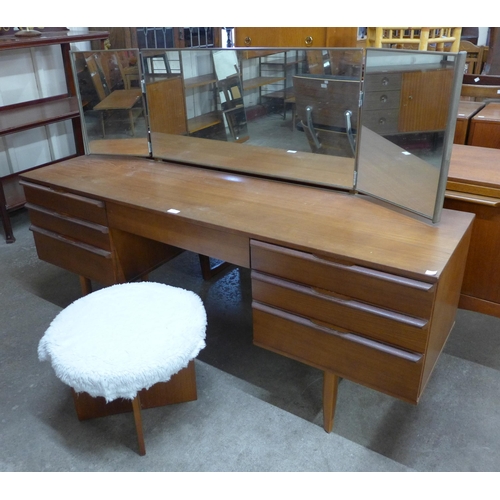 102 - An Avalon teak dressing table and stool