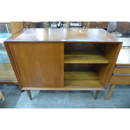 114 - A Danish teak single sliding door cabinet