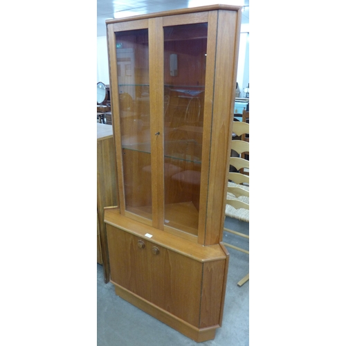 116 - A Turnidge of London teak corner cabinet