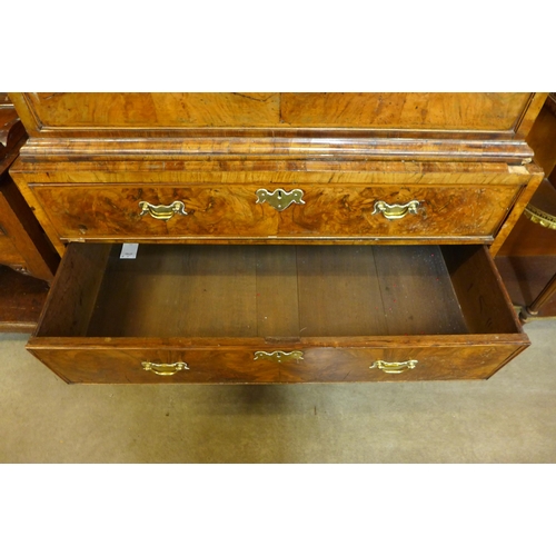 140 - A George I figured walnut chest on chest