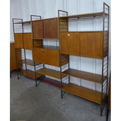 17 - A Staples teak and gold metal three bay Ladderax room divider