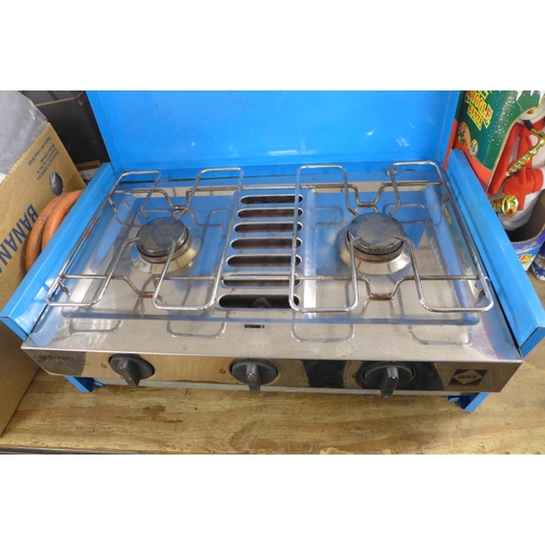 2391 - A 2 burner camp cooker with grill and a portable gas stove with gas bottle