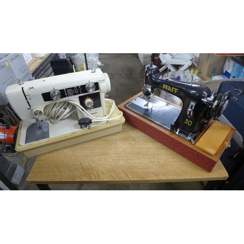 2394 - A Pfaff 30 vintage style sewing machine in a case and a New Home sewing machine in a case - New Home... 