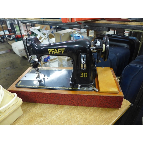 2394 - A Pfaff 30 vintage style sewing machine in a case and a New Home sewing machine in a case - New Home... 