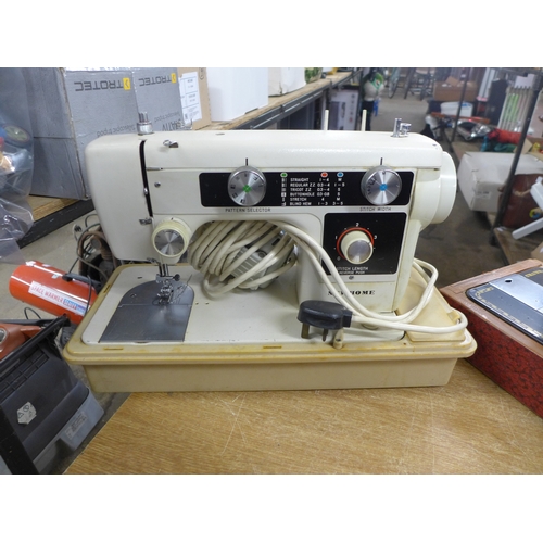 2394 - A Pfaff 30 vintage style sewing machine in a case and a New Home sewing machine in a case - New Home... 