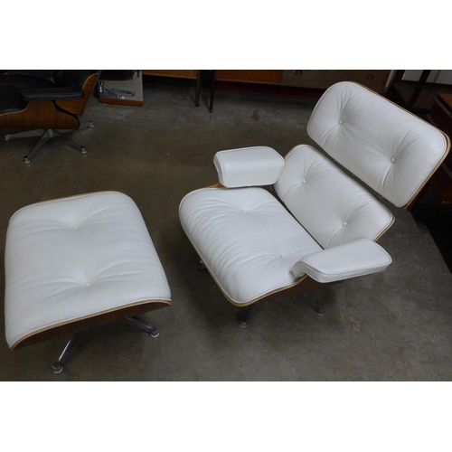 28 - A Charles & Ray Eames style simulated rosewood and white leather revolving lounge chair and ottoman
