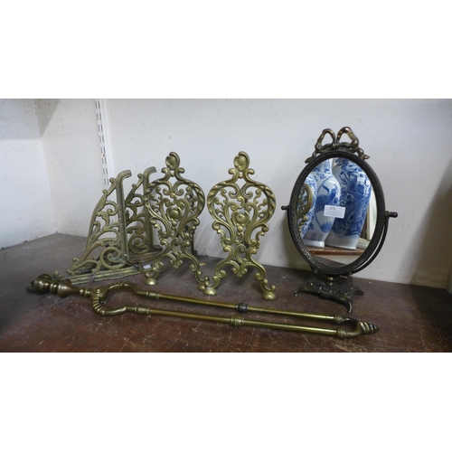 375 - A pair of Art Nouveau brass andirons, a toilet mirror and a pair of brackets