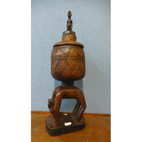 378 - An African carved wood figural ceremonial cup on stand