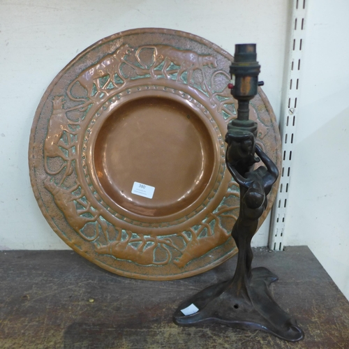 380 - A French Art Nouveau bronze effect female nude table lamp and a copper charger